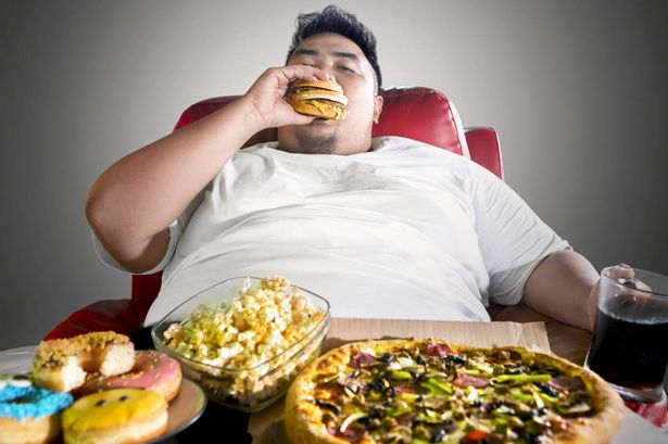 Researchers conducting clinical trials for new obesity treatment strategies